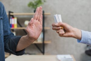 1-man-refusing-bunch-cigarettes-offered-by-his-femal